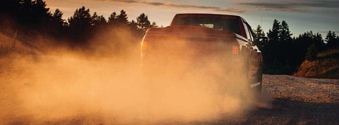 Truck driving on dirt road with TOFF bed liner